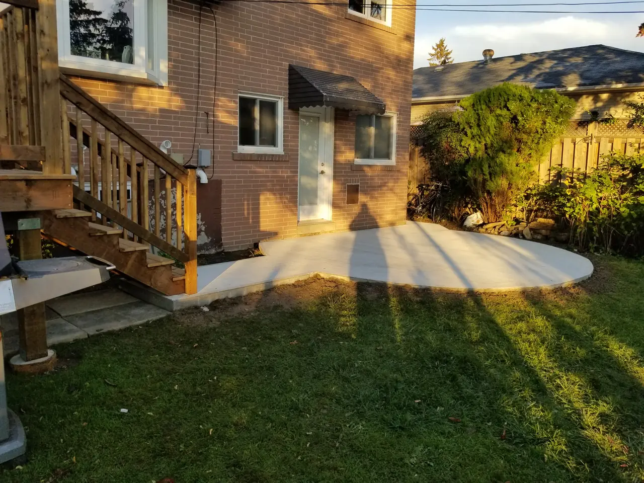 Rear entry and patio by MATCON INC.