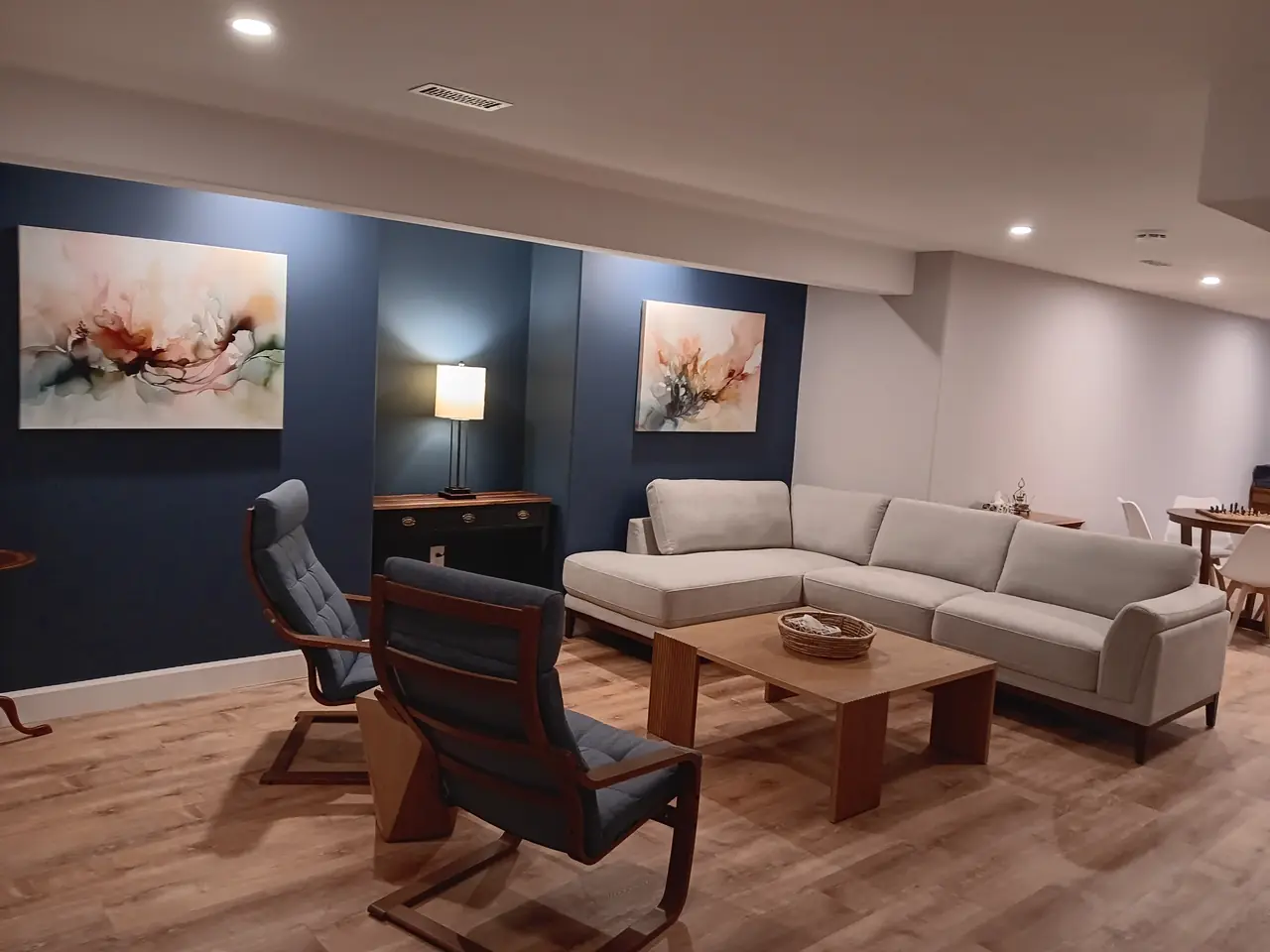 Finished lounge basement by MATCON INC.